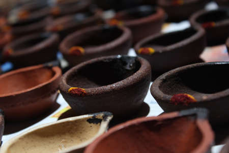 Vilakkudi, Tamilnadu India - November 09 2020: Artistic homemade clay oil lamps or karthikai deepam are ready for diwali and karthikai festivalsのeditorial素材
