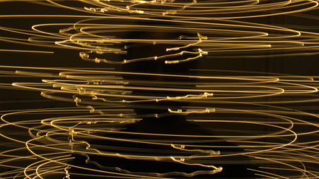 Abstract colorful irregular lines on black,green background photo with long exposure . Light painting photography. Lights with irregular patterns for overlayの写真素材