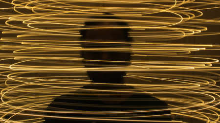 Abstract colorful irregular lines on black background photo with long exposure.Light painting photography.Lights with irregular patterns for overlayの写真素材