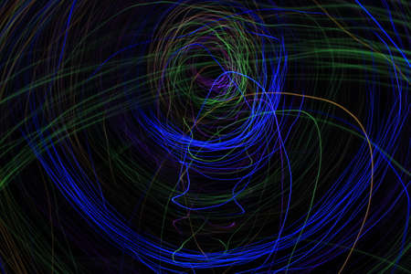 Light painting Abstract colorful irregular lines or patterns on black background with long exposure.の写真素材