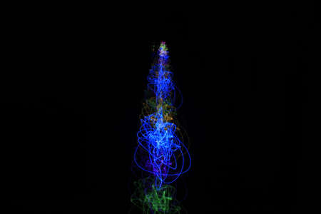 Light painting Abstract colorful irregular lines or patterns on black background with long exposure.の写真素材