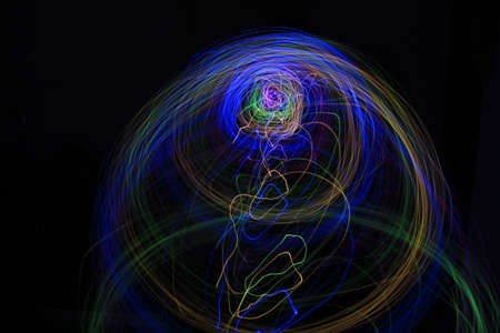 Light painting Abstract colorful irregular lines or patterns on black background with long exposure.の写真素材