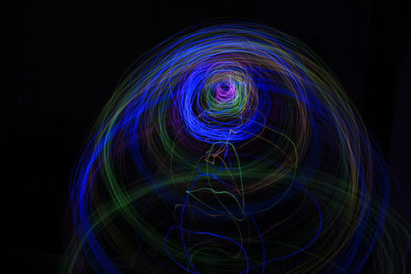 Light painting Abstract colorful irregular lines or patterns on black background with long exposure.の写真素材