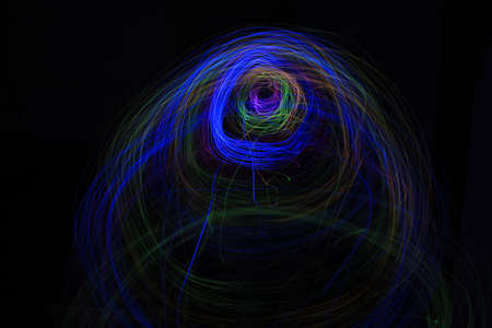 Light painting Abstract colorful irregular lines or patterns on black background with long exposure.の写真素材