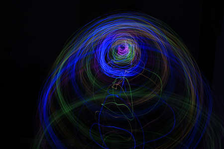 Light painting Abstract colorful irregular lines or patterns on black background with long exposure.の写真素材