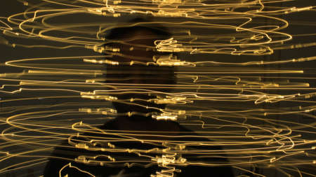 Abstract colorful irregular lines on black background photo with long exposure.Light painting photography.Lights with irregular patterns for overlayの写真素材