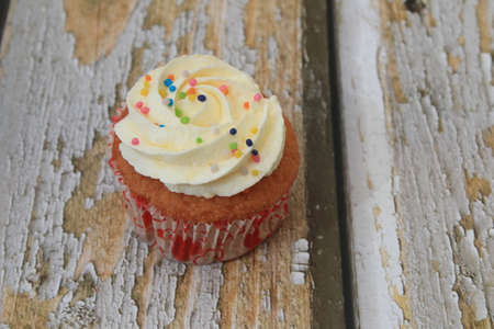 Homemade tutti frutti candied fruit sponge cake on table and colorful background for Christmasの写真素材