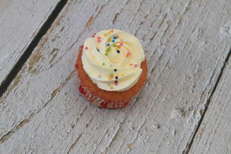 Homemade tutti frutti candied fruit sponge cake on table and colorful background for Christmasの写真素材