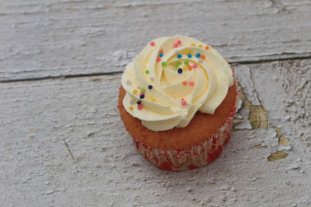 Homemade tutti frutti candied fruit sponge cake on table and colorful background for Christmasの写真素材