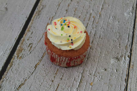 Homemade tutti frutti candied fruit sponge cake on table and colorful background for Christmasの写真素材