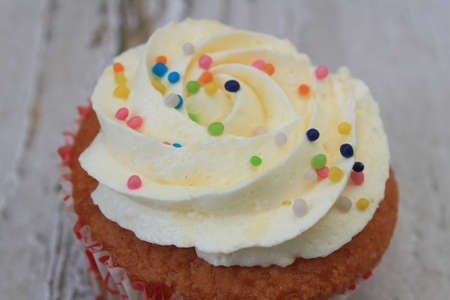 Homemade tutti frutti candied fruit sponge cake on table and colorful background for Christmasの写真素材