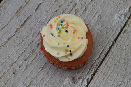 Homemade tutti frutti candied fruit sponge cake on table and colorful background for Christmasの写真素材