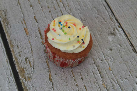Homemade tutti frutti candied fruit sponge cake on table and colorful background for Christmasの写真素材