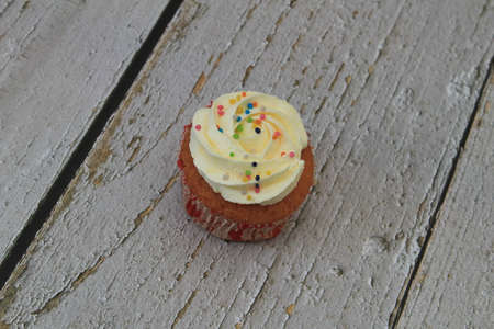 Homemade tutti frutti candied fruit sponge cake on table and colorful background for Christmasの写真素材