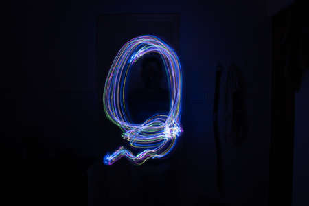 Light painting Abstract colorful irregular lines or patterns on black background with long exposure.の写真素材