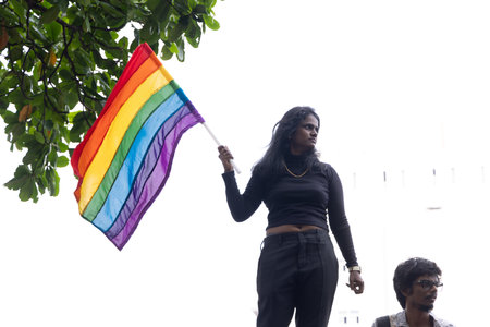 Chennai, Tamilnadu India - June 25 2023 : Rear view of Group of people with pride rainbow flag and banners in the pride parade.のeditorial素材