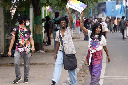Chennai, Tamilnadu India - June 25 2023 : Rear view of Group of people with pride rainbow flag and banners in the pride parade.のeditorial素材
