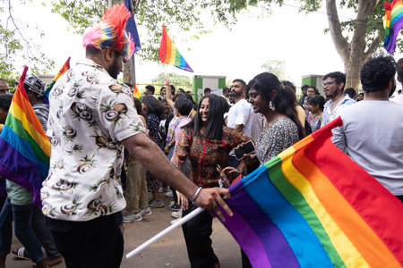 Chennai, Tamilnadu India - June 25 2023 : Rear view of Group of people with pride rainbow flag and banners in the pride parade.のeditorial素材