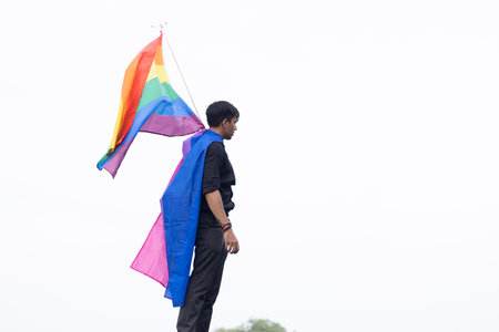 Chennai, Tamilnadu India - June 25 2023 : Rear view of Group of people with pride rainbow flag and banners in the pride parade.のeditorial素材