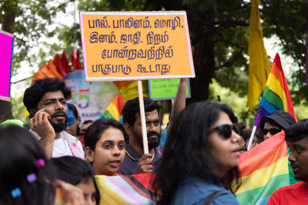 Chennai, Tamilnadu India - June 25 2023 : Rear view of Group of people with pride rainbow flag and banners in the pride parade.のeditorial素材