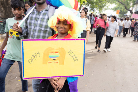 Chennai, Tamilnadu India - June 25 2023 : Rear view of Group of people with pride rainbow flag and...