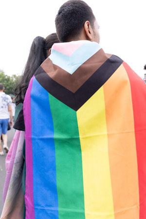 Chennai, Tamilnadu India - June 25 2023 : Rear view of Group of people with pride rainbow flag and...