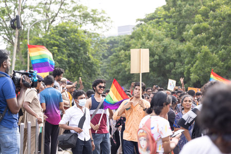 Chennai, Tamilnadu India - June 25 2023 : Rear view of Group of people with pride rainbow flag and banners in the pride parade.のeditorial素材