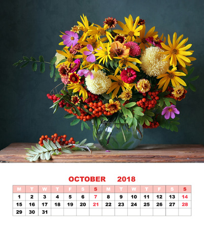 Design page calendar October 2018. Autumn bouquet with garden flowers and branches of mountain ash.の写真素材