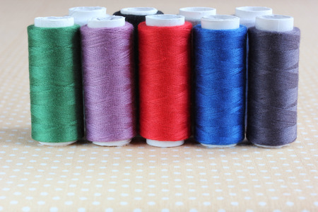 Colored thread in the bobbin. Sewing, needlework. Selective focus. Place for text.