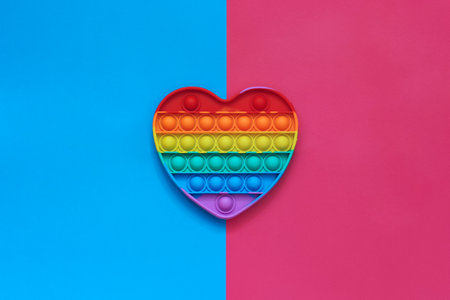 Rainbow antistress toy in the shape of a heart.の写真素材