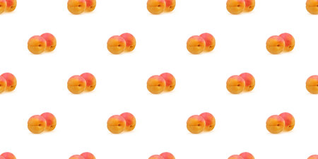 Seamless pattern of ripe apricots on a white background, creating a visually appealing design for food-related projectsの写真素材
