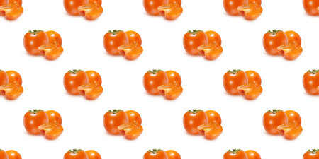 Seamless pattern of fresh, ripe persimmon fruits, whole and sliced, creating a vibrant and colorful designの写真素材