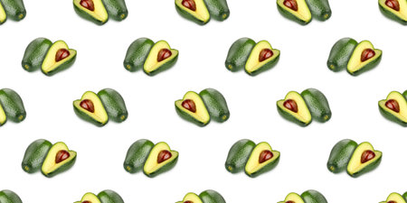 Seamless pattern of whole and halved avocados showing seed, creating a visually appealing design on...