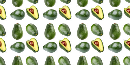 Fresh avocados, whole and halved, creating a vibrant seamless pattern on a white backgroundの写真素材