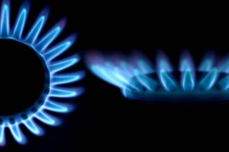 Blue fire of a gas cookerの写真素材