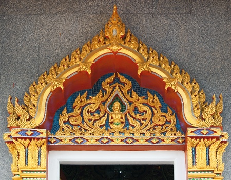 Wooden door with gold in the Thai templeの写真素材