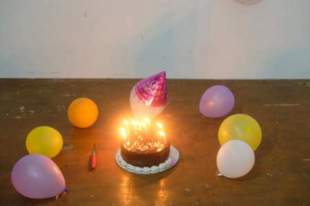 Birthday celebrations decoration with colorful balloons and birthday capの写真素材