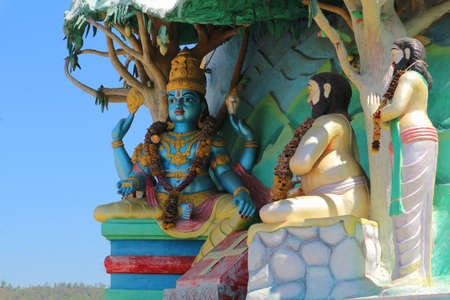 Lord Vishnu and two wise men. Sculpture of religious themes in Tirupati, India.の写真素材