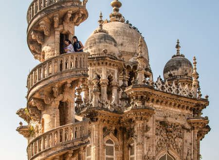 Junagadh, Gujarat, India - December 2019: Tourists walk down the spiral staircase of a minaret of the beautifully ornate mausoleum of Mahabat Maqbara in the old city.のeditorial素材