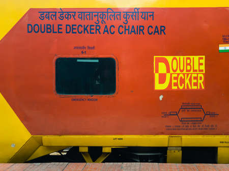 Bangalore, Karnataka, India - January 2020: The bright red and yellow bogie of the double decker...
