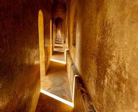 Lucknow, Uttar Pradesh, India - February 2015: Inside a narrow passage in the arcaded interiors of the Bhulbhulaiya labyrinth.のeditorial素材