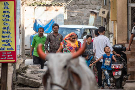 Somnath, Gujarat, India - December 2018:  A large group of Indian people walking on the streets of the old town.のeditorial素材