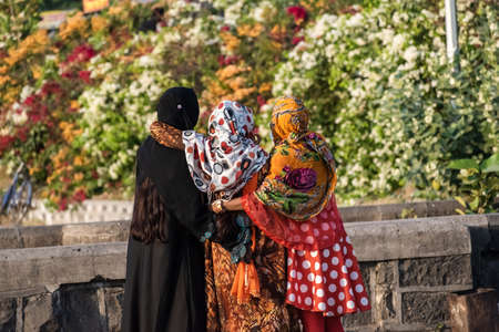 Nagpur, Maharahstra, India - March 2019: Back profile of three young Indian muslim girls wearing...