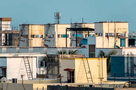 Chennai, Tamil Nadu, India - January 2020: Rooftops of a congested, modern low rise housing complex in the suburb of Pallavaram.の写真素材