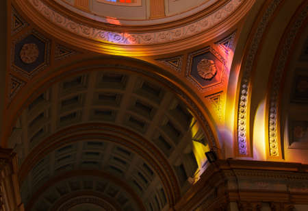 Colorful light hitting the high ceiling walls of the Roman Catholic Our Lady of Angels Church in...