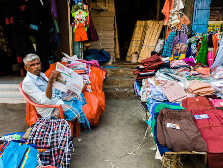 Trichy, Tamil Nadu, India - February 2020: A street vendor selling men's clothing in a market in Tiruchirappalli.のeditorial素材