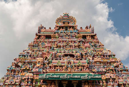 Trichy, Tamil Nadu, India - February 2020: The beautifully carved and colorful entrance tower to the ancient Ranganathaswamy temple in Srirangam.のeditorial素材
