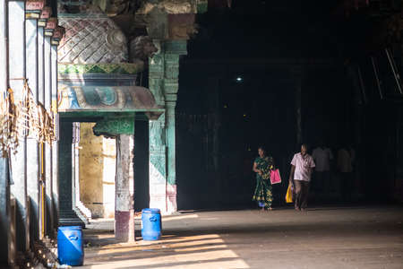 Mayiladuthurai,  Tamil Nadu, India - February 2020: Indian pilgrims walking inside the ancient Hindu temple at Vaitheeswaran Koil.のeditorial素材