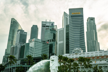 Singapore - October 2012: The tall skyscrapers of the central financial district of downtown Singapore around the Merlion park.のeditorial素材
