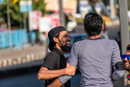 Bhopal, Madhya Pradesh,India - March 2019: A young Indian man smiling and having fun with a friend on the streets of the city of Bhopal.のeditorial素材